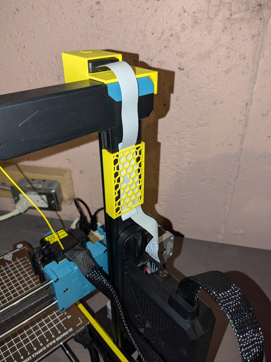 The back side of the completed repair, showing the ribbon cable from the control board to the SD card mount.